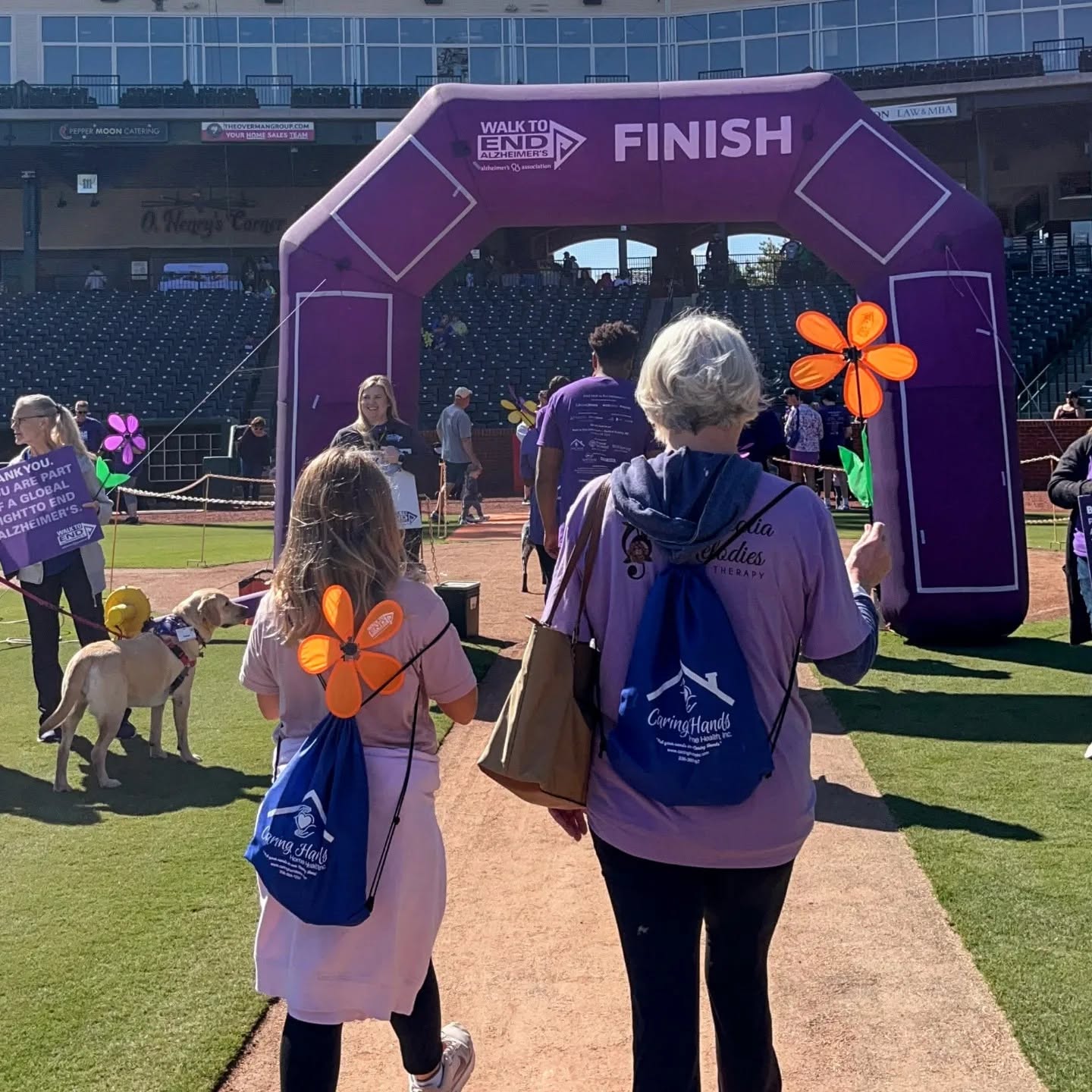 Walking through the finish arch at the Walk to End Alzheimer's