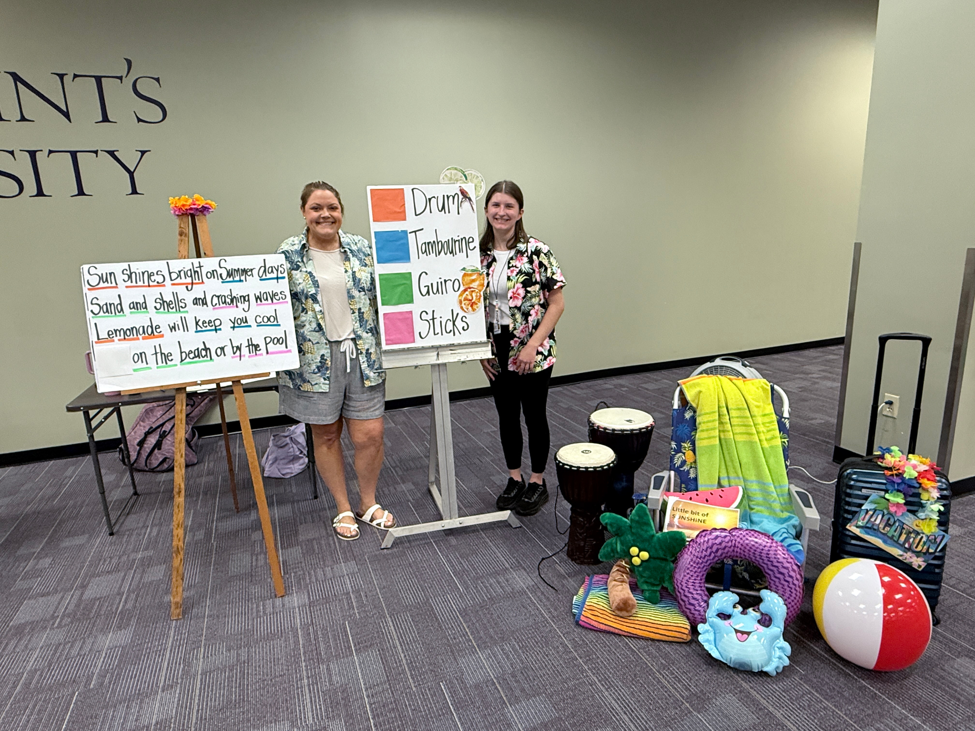 Two therapists with a summer-themed music therapy setup